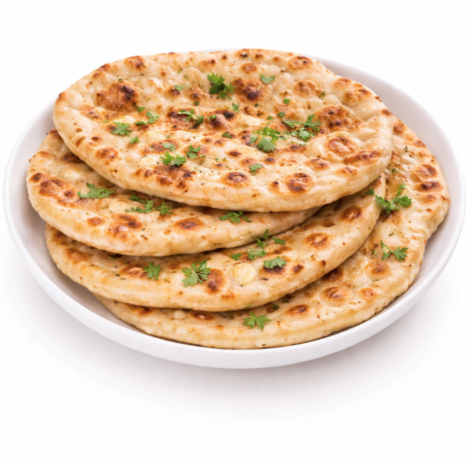 Un NAN ROTI (Pièce), doré et garni d'herbes vertes fraîches, est servi dans un bol blanc sur fond blanc.