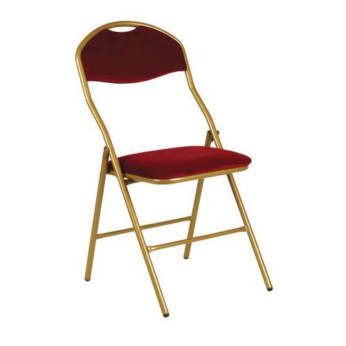 La CHAISE LUXE PLIANTE VELOURS BORDEAUX, dotée d'une structure dorée et d'une assise et d'un dossier en velours rouge, est présentée debout sur un fond blanc uni.